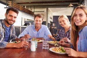 A group of friends eating at a restaurant